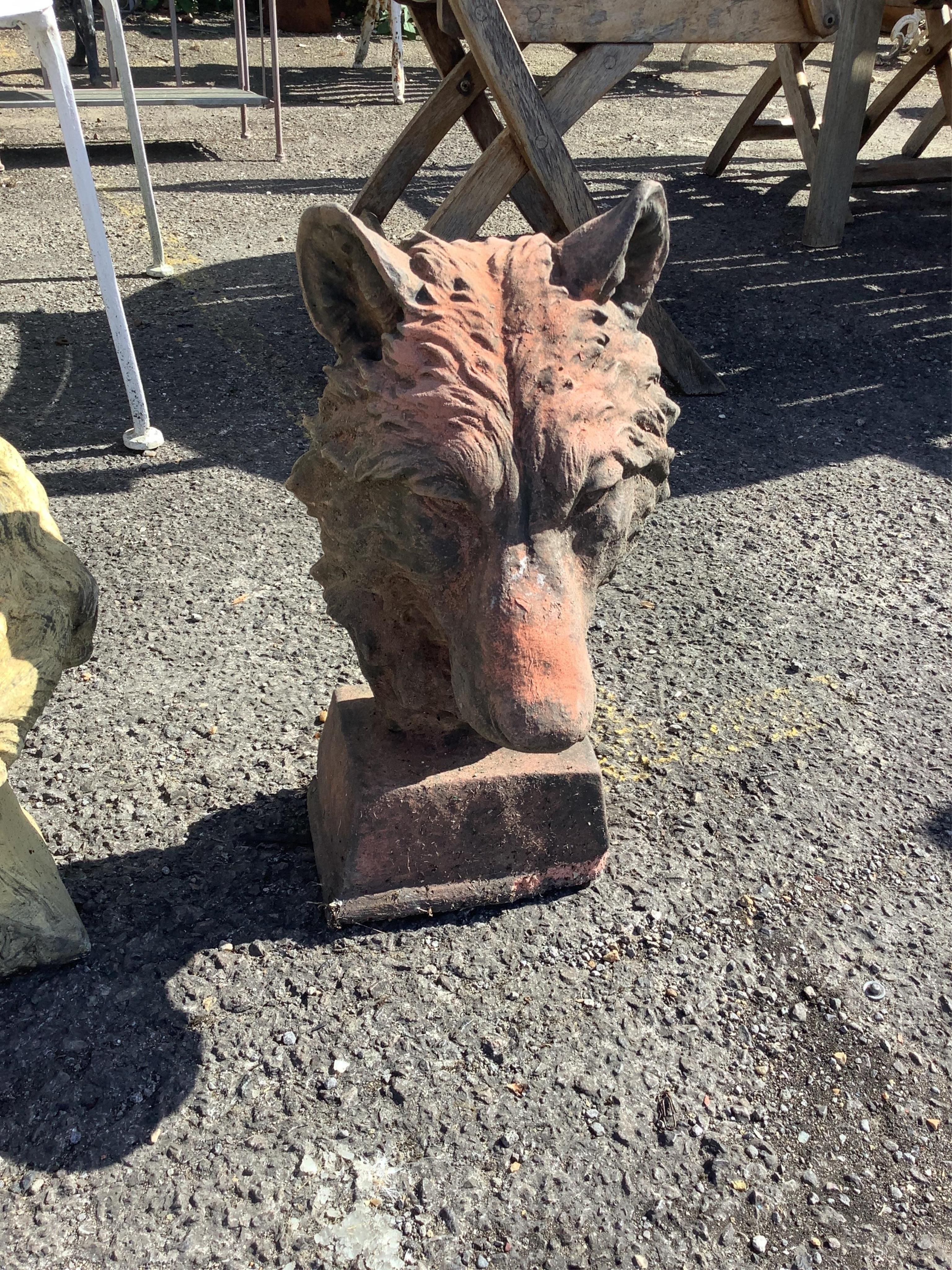 Four cast stone and terracotta garden busts, largest height 46cm
